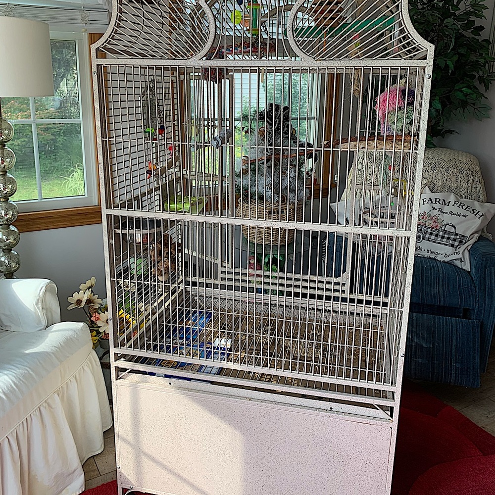 Cream colored, floor standing. Storage on bottom. All toys